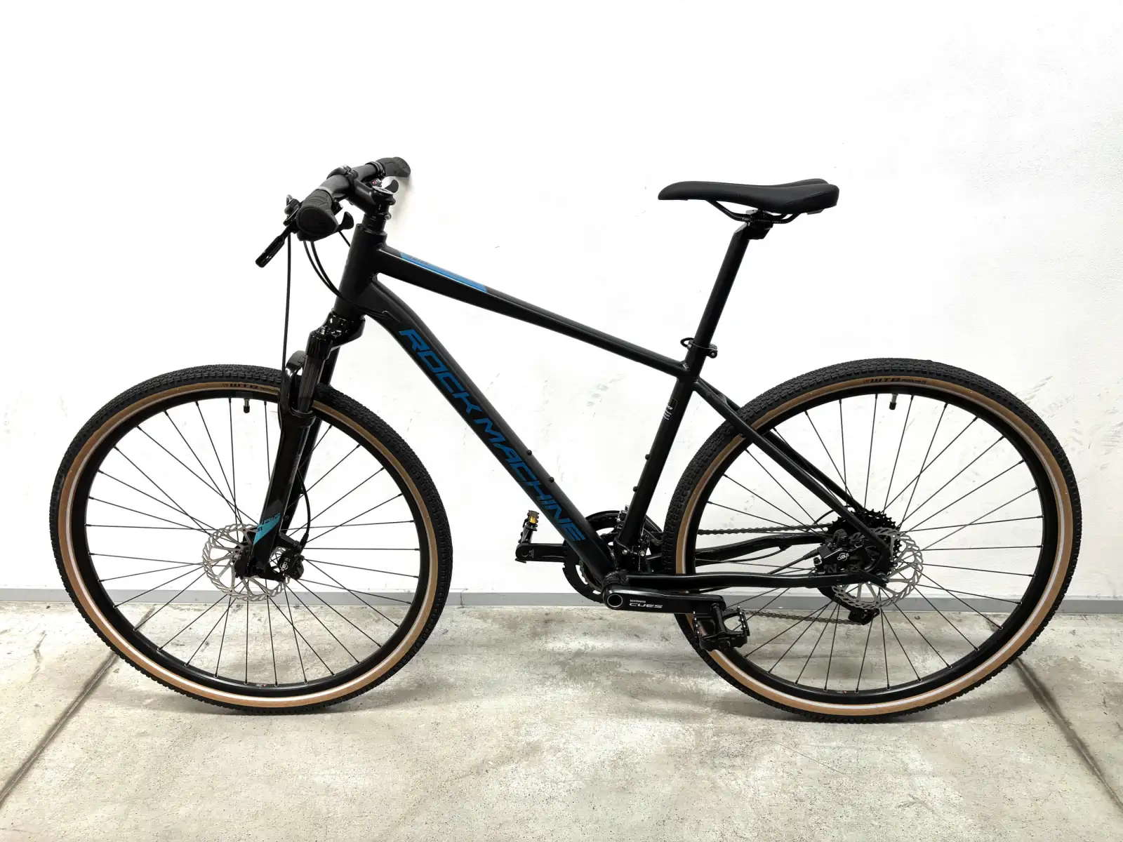 Rock Machine CrossRide 700 trekingové kolo black/petrol VZOREK