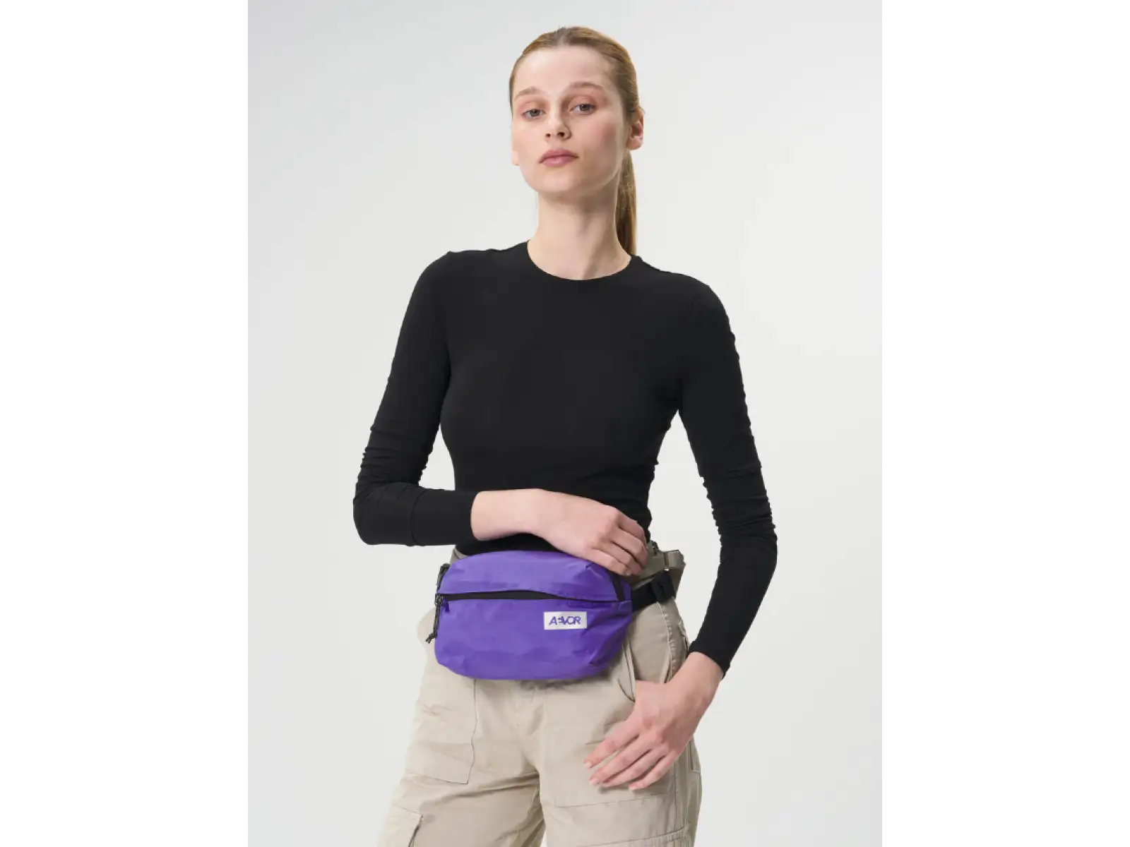 Aevor Hip Bag Ease taška přes rameno/ledvinka Purple